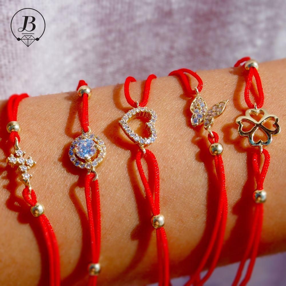 Златна гривна с червен конец – мода, съчетана с народните традиции